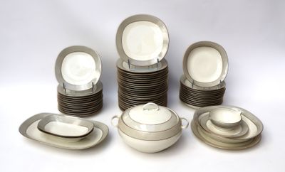 a lot of plates and bowls on the table