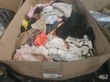 a box full of clothes that is sitting on a table