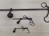 a pair of scissors and a pair of hooks on a table