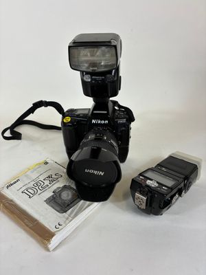 a camera and a flasher sitting next to each other