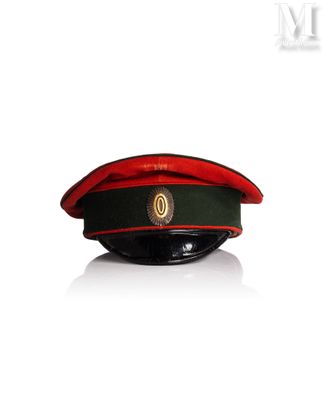 a red and green hat on a white surface