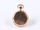 a close up of a gold pocket watch on a white background