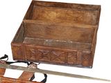 a wooden box with a knife and a pair of scissors in it