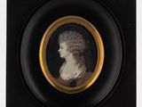 portrait of a woman in a black frame with a gold rim