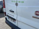 a white van that is parked in a parking lot