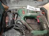 a box with a cordless drill and other tools in it