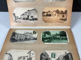 an old photo of an open book with pictures of buildings on it