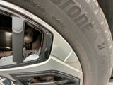 a close up of a car tire with a wheel on it