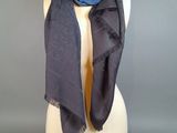 blue and black scarf on a mannequin head