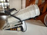 a bag of plastic wrapped up on top of a machine