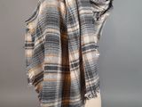 an image of a plaid scarf on a mannequin head