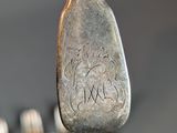 a spoon and fork that are sitting on a table