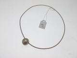 an image of a necklace with a tag on it
