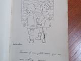 an open book with a drawing of a boy and a girl