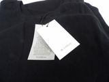 a close up of a black t - shirt with a tag on it