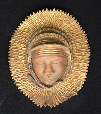 an image of a gold mask on a black background
