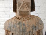 a wooden statue of a darth vader with a helmet on