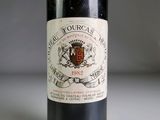 a bottle of wine that is sitting on a table