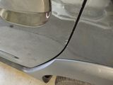 a close up of a car ' s door handle with a sticker on it