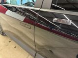a car that has a flag on the side of it