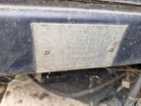 a close up of a metal plate on the back of a vehicle