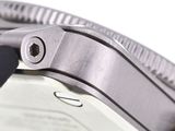 a close up of a watch on a white surface
