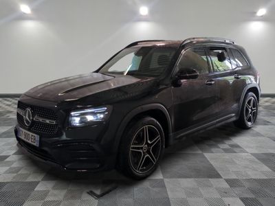 the mercedes gle suv is parked in a large room