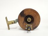 a small wooden fishing reel with a metal spool