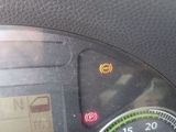 a close up of a car dashboard with a speedometer