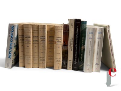 a lot of books that are stacked on top of each other