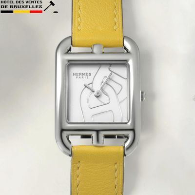 an image of a close up of a wrist watch with a yellow strap