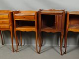 three wooden nightstands with drawers and drawers on each side of them