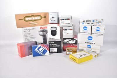 a lot of different types of electronic equipment on the table