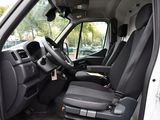 a white van with black seats in a parking lot