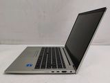 a laptop that is sitting on a white table