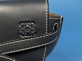 a close up of a black leather wallet with white stitching