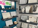 a display of jewelry on the wall in the room