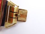 a red and black bracelet with a gold clasp
