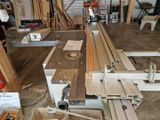 a machine that is working on a piece of wood