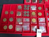 a red box filled with lots of coins and a price tag
