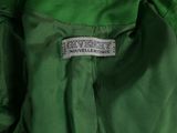 an image of a close up of a green jacket with a label on it