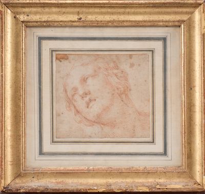 un tableau représentant la tête d'un homme, dans un cadre doré