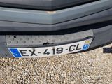 a close up of a plate on the front of a car