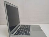 a laptop computer sitting on a table with a white background