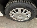 a close up of a tire on the side of a car