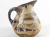 un vase sur lequel est représenté un homme et un cheval