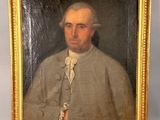 portrait of a man in a military uniform with a cane in a gold frame