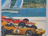 a poster of a race car and a sailboat on the beach