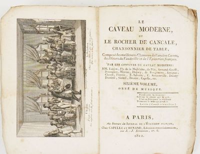 un vieux livre dans lequel figure la photo d'un groupe de personnes