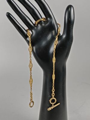 CHAINE de MONTRE en or jaune (750/°°°) à maille ajourée.